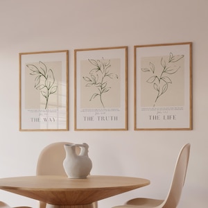 以下が含まれることがあります： ベージュの背景に植物の枝のミニマルな線画が描かれた、額装された3枚のウォールアートプリント。各プリントには「John 14:6」のテキストと、「THE WAY」「THE TRUTH」「THE LIFE」というフレーズが黒いセリフ体で記されています。