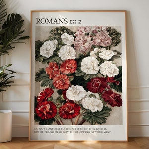 Könnte beinhalten: Ein gerahmter Druck mit einer floralen Illustration von weißen, rosa und roten Blumen. Der Druck enthält den Text "Römer 12:2" und das Zitat "Lasst euch nicht von dieser Welt formen, sondern lasst euch durch die Erneuerung eures Sinnes verwandeln."