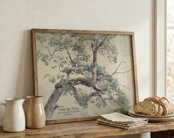 Puede incluir: Una impresión enmarcada de un árbol con el texto "Yo soy la vid, vosotros los sarmientos" en un entorno rústico. Dos jarras de cerámica y un plato de pan están sobre una mesa de madera. Una servilleta a cuadros doblada también está sobre la mesa.