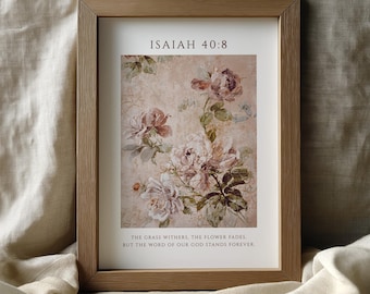 May include: Framed floral art print featuring a vintage-style botanical illustration of pink and white flowers. The print includes the text "ISAIAH 40:8" and a quote about the enduring nature of God's word. The frame is a light brown color.