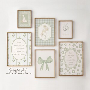 May include: A set of framed art prints in a soft, muted colour palette. The prints feature botanical illustrations, a bow, and inspirational quotes. The frames have a gold finish, and the overall aesthetic is vintage and elegant.