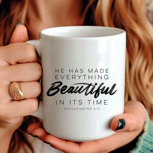 May include: White ceramic mug with black text that reads "He has made everything beautiful in its time Ecclesiastes 3:11".