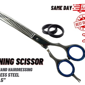 May include: Silver thinning shears with blue accents. The shears are 5.5 inches long and are made of stainless steel. The shears are for right-handed use.