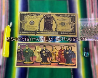 May include: A set of Santa Muerte religious items including a gold-coloured paper bill with a picture of Santa Muerte, a small bag of glitter, a small bottle of liquid, and a card with a picture of seven Santa Muerte figures.