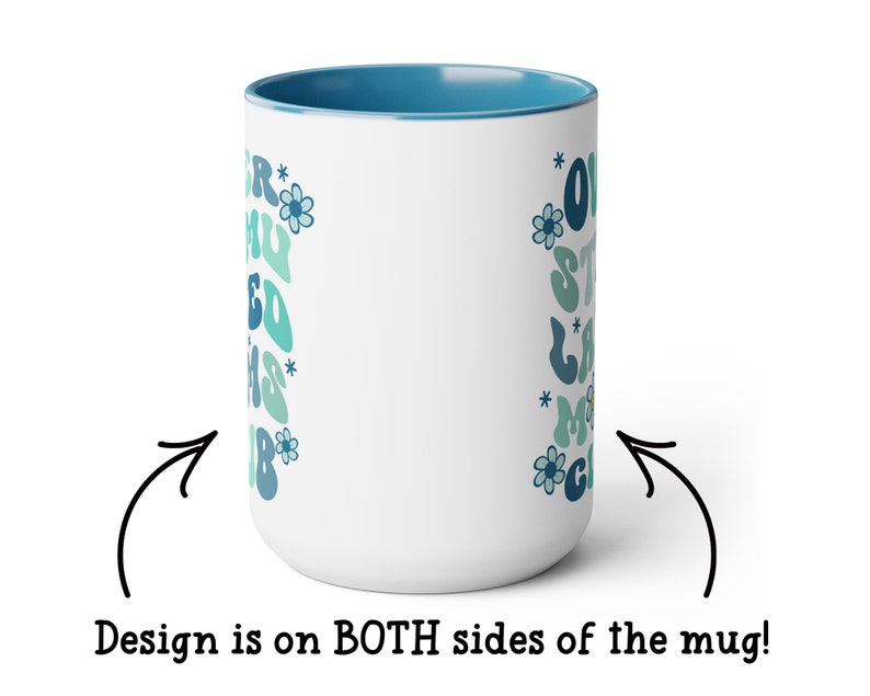 May include: White ceramic mug with a blue rim. The mug has a design on both sides featuring a blue and green retro-style font that says "Our Staycation Mood" with flowers and stars. The design is on both sides of the mug.