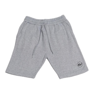 May include: Gray sweat shorts with a drawstring waist and side pockets. The shorts have a small black circular logo on the lower right leg. The shorts are made of a soft, comfortable material.