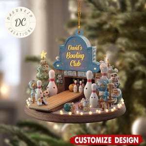 May include: A decorative Christmas ornament featuring a miniature bowling alley scene. The ornament includes bowling pins, a lane, and a sign that reads "David's Bowling Club." The base is a wooden circle with small lights.