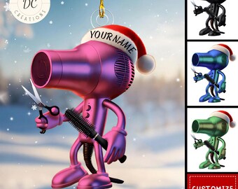 May include: A pink and purple hairdryer Christmas ornament wearing a Santa hat with the text "YOUR NAME". The ornament is holding scissors and a hairbrush. Additional color options are shown on the right.