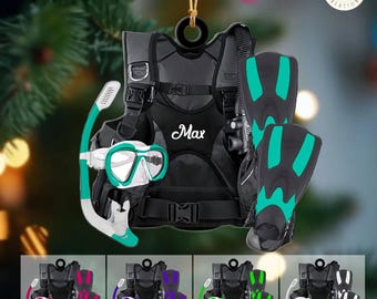 May include: A black scuba diving ornament with teal accents, featuring a diving vest, mask, snorkel, and fins. The name "Max" is printed on the vest. The text "COLOR & TEXT CAN BE CHANGED" is at the top.