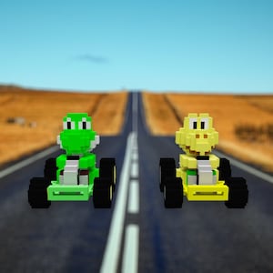 May include: Two pixelated toy race karts, one green and one yellow, race down a long asphalt road. The green kart features a green character with white accents, while the yellow kart has a yellow character. Both have black wheels and are set against a blurred landscape.