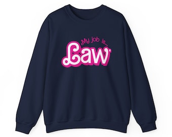 May include: A navy blue sweatshirt with a pink graphic that says "My job is... Law" in a stylized font.