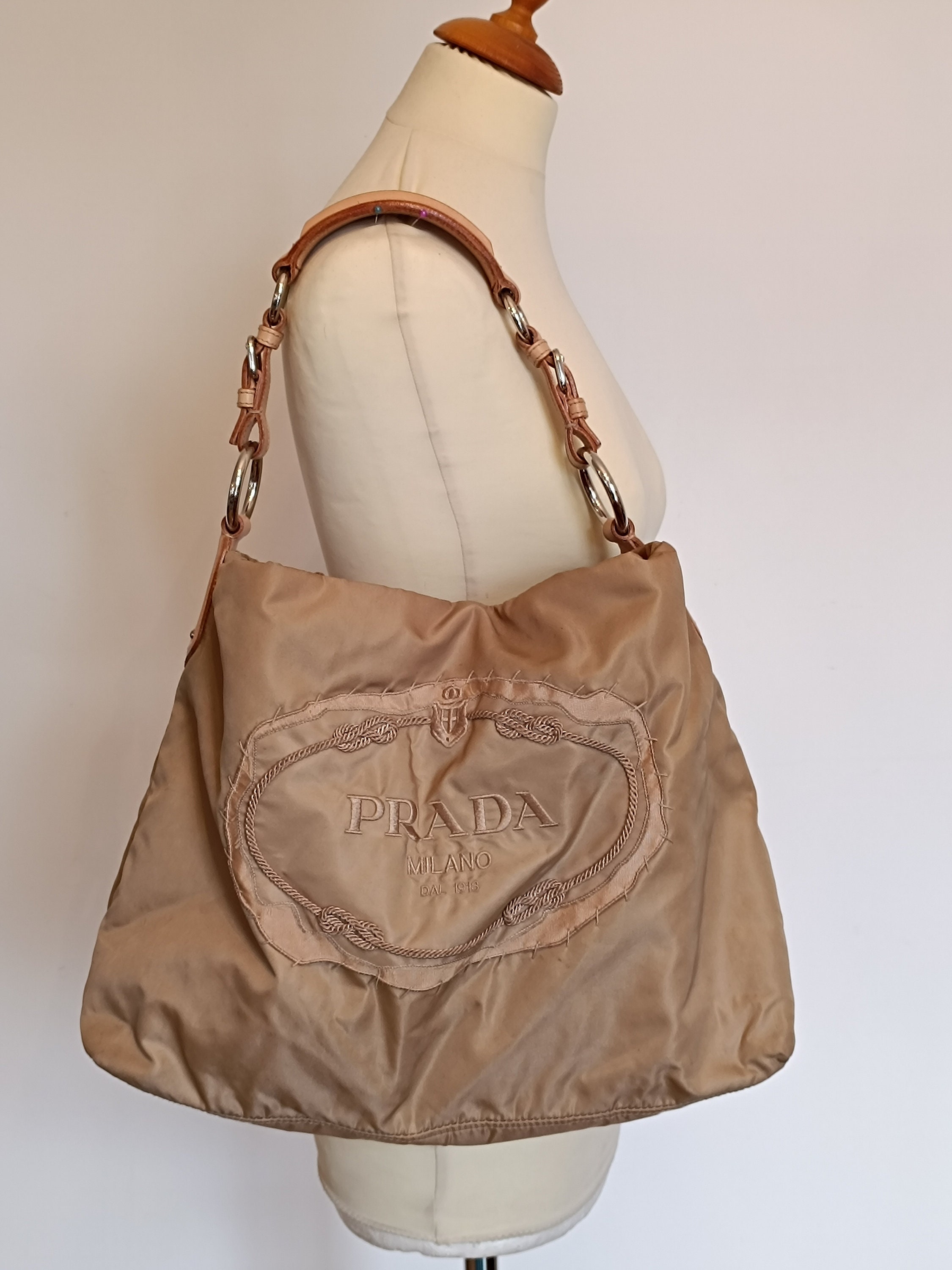 Prada emblem bag hotsell