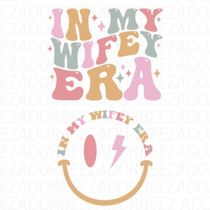 May include: A graphic design with the text "In My Wife Era" in a retro font style. The text is in pink, green, and orange colors. A smiley face with a lightning bolt is below the text.