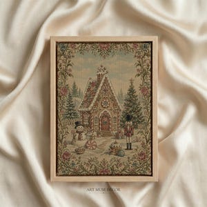 May include: A rectangular framed wall art piece featuring a woven tapestry design of a gingerbread house, a snowman, and a nutcracker in a snowy landscape. The scene is surrounded by a decorative floral border in shades of red, green, and gold.