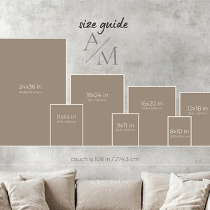 The image is a wall with a series of framed photographs or images of varying sizes, arranged in a grid format. The text above the images reads "size guide A/M", indicating that the images are related to the size guide A/M. The couch is described as being 10B in size, which is approximately 74.3 cm.