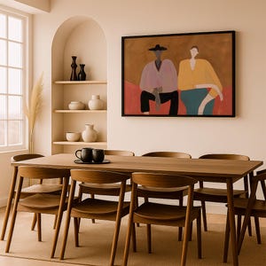 May include: A rectangular wall art print in a black frame depicting two stylized figures sitting side by side. The figure on the left wears a light purple top and black hat, while the figure on the right wears a yellow top. The background is brown.