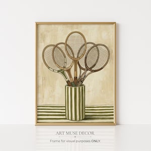 May include: A framed print featuring a collection of vintage tennis rackets arranged in a green and white striped vase. The rackets have wooden frames and are displayed against a neutral background. The text "ART MUSE DECOR" and "Frame for visual purposes ONLY" are at the bottom.