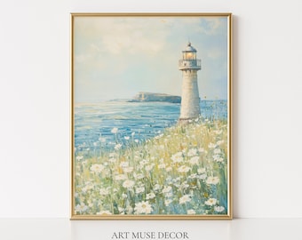 May include: A framed painting of a lighthouse on a cliff overlooking the ocean. The artwork features a light blue sky, white flowers, and a golden frame. The text "ART MUSE DECOR" and "Frame for visual purposes ONLY." are at the bottom.