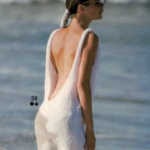 Slinky dress knitting pattern with a very low back neckline to create an original and very flattering style.