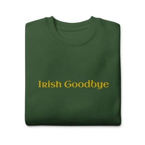 May include: A dark green t-shirt with the text "Irish Goodbye" in gold lettering.