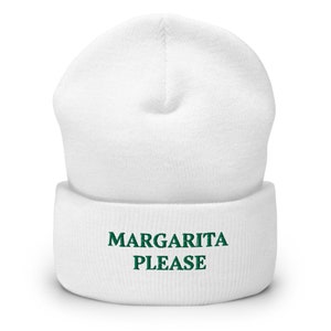 May include: White knit beanie with a green embroidered design that says "MARGARITA PLEASE".