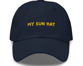May include: A navy blue baseball cap with the text "MY SUN HAT" embroidered in yellow.