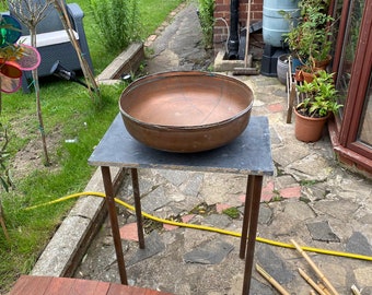 Recycled copper cylinder basin.