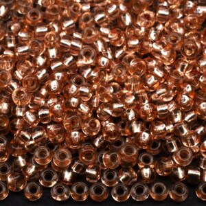 10/0 78185 Perline Preciosa Rocailles. Cristallo arancione bicolore, foderato in argento. Perline in vetro ceco.