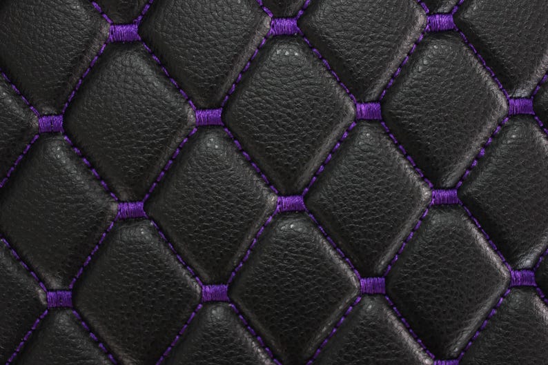 May include: Black leather upholstery with a diamond pattern and purple stitching.