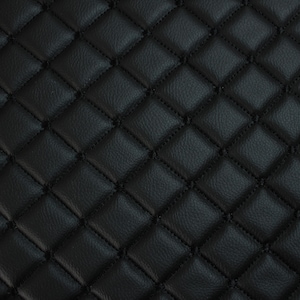 May include: A close-up shot of a black quilted leather texture. The surface is patterned with stitched diamond shapes. The stitching is a darker black, providing a subtle contrast against the slightly shiny leather.