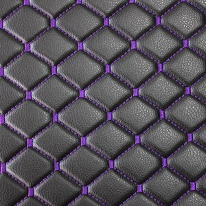 May include: Black leather upholstery with a diamond pattern stitched in purple thread.