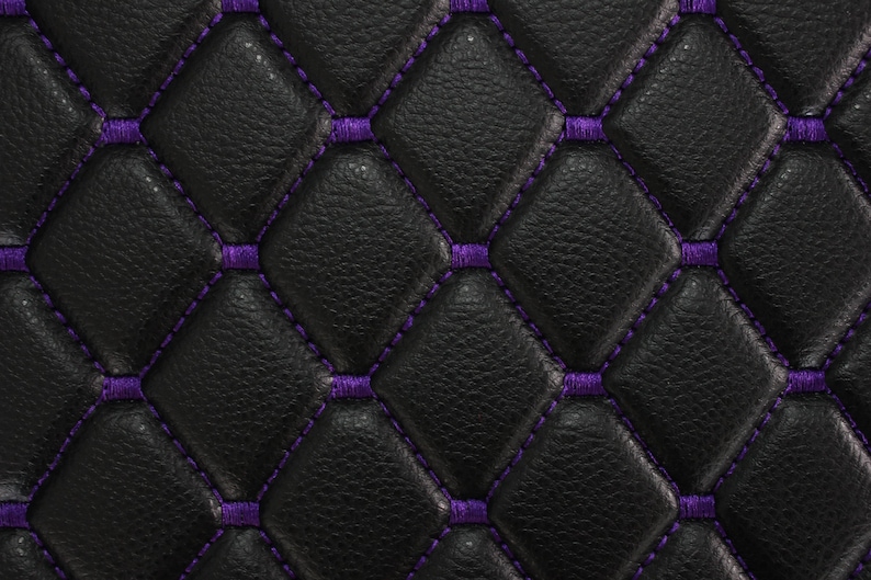 May include: Black leather upholstery with a diamond pattern and purple stitching.