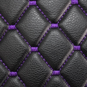 May include: Black leather upholstery with a diamond pattern and purple stitching.