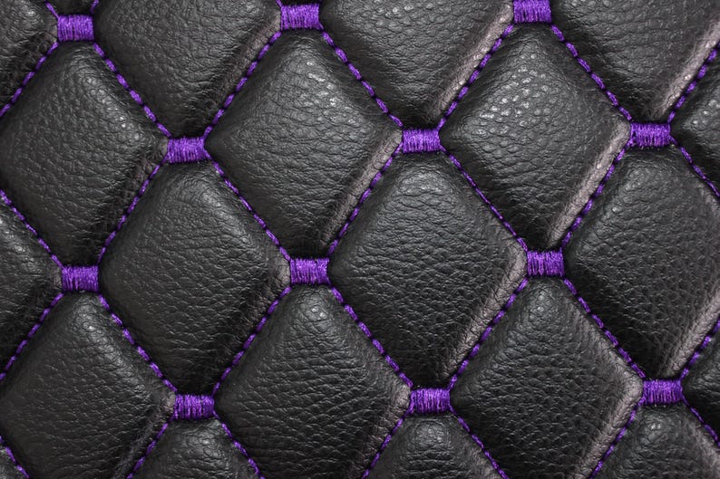 May include: Black leather upholstery with a diamond pattern and purple stitching.