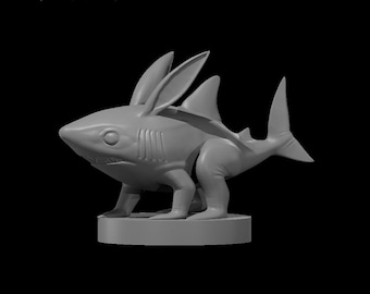 May include: A gray 3D printed figurine of a shark with rabbit ears and legs. The shark is standing on a round base.