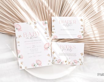 May include: A set of three baby shower cards with a floral design. The cards are white with pink and yellow flowers and the text "Baby in Bloom", "Diaper Raffle", and "Books for Baby".
