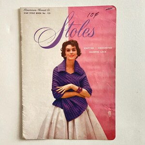 May include: A vintage American Thread Co. Star Stole Book No. 133 pattern booklet with a pink and white cover. The cover features a person wearing a purple knitted stole, with text reading Stoles, Knitted, Crocheted, Hairpin Lace, and 10 cents.