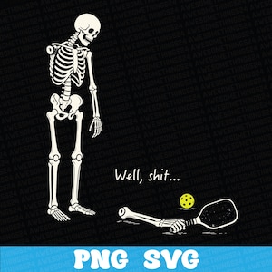 May include: A graphic illustration on a black background featuring a standing skeleton looking down at a detached skeletal arm holding a pickleball paddle next to a yellow pickleball. The text Well, shit... is printed in white above the arm.