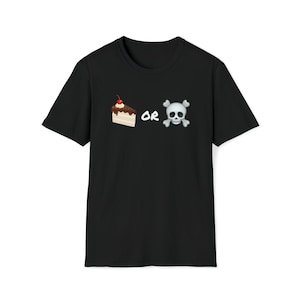 May include: Black t-shirt featuring a slice of cake with a cherry and a skull with crossbones. The word "OR" is between the cake and skull graphics. The shirt is made of a soft material.