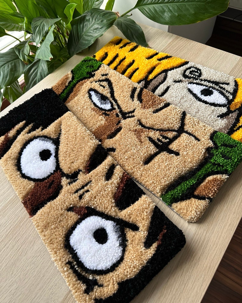 May include: Three colorful rug patches featuring cartoon faces with large eyes. The rugs are made of a soft, fuzzy material and are perfect for adding a pop of color to any room.