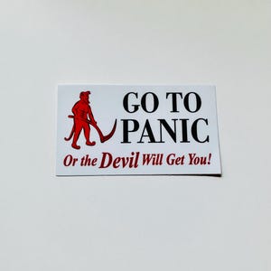 May include: A rectangular white sticker featuring a red graphic of a devil figure holding a pitchfork. The text in black reads GO TO PANIC, and the text in red below reads Or the Devil Will Get You! The design is printed on a clean white background.