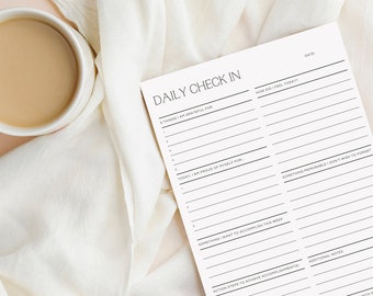 May include: A printable daily check-in sheet with sections for gratitude, accomplishments, and reflection. The sheet has a simple black and white design.