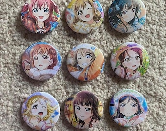 Love Live Sunshine Aqours World Trip themed 32mm metalback pins