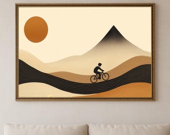 Peut inclure: Impression d'art encadrée représentant un cycliste dans un paysage de montagne stylisé. L'œuvre utilise des tons chauds de terre, avec un grand soleil orange et un pic de montagne noir. Le cycliste est représenté en silhouette.