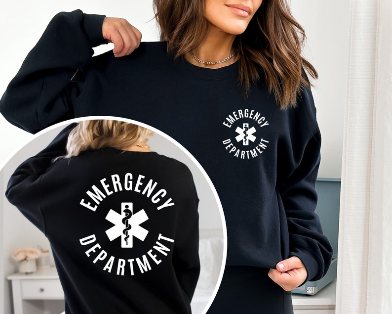 May include: Black sweatshirt with a white circle graphic on the front and back. The graphic features a medical symbol with a snake and the text "Emergency Department".