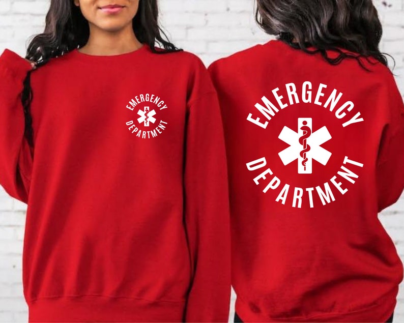 May include: Red sweatshirt with a white graphic of a medical symbol and the text "Emergency Department".