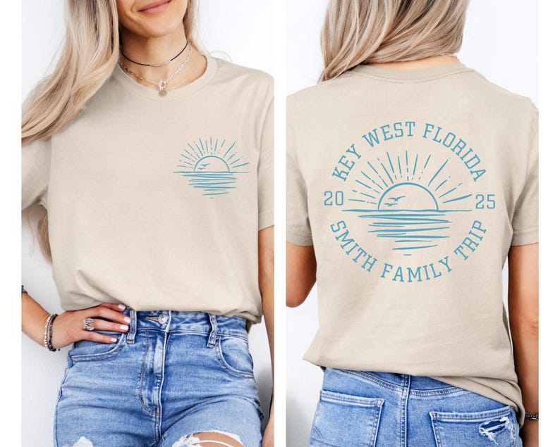 May include: A tan t-shirt with a blue graphic of a sunset over the ocean with birds flying. The back of the shirt has a blue graphic of a sunset with the text "Key West Florida 2025 Smith Family Trip".