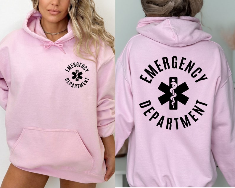 May include: Pink hoodie with a black graphic of a medical symbol and the text "Emergency Department".