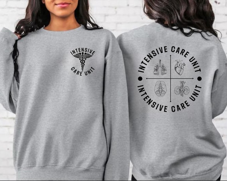 May include: A gray sweatshirt with the words "Intensive Care Unit" and a medical symbol on the front. The back of the sweatshirt features a circular design with the words "Intensive Care Unit" and illustrations of internal organs.