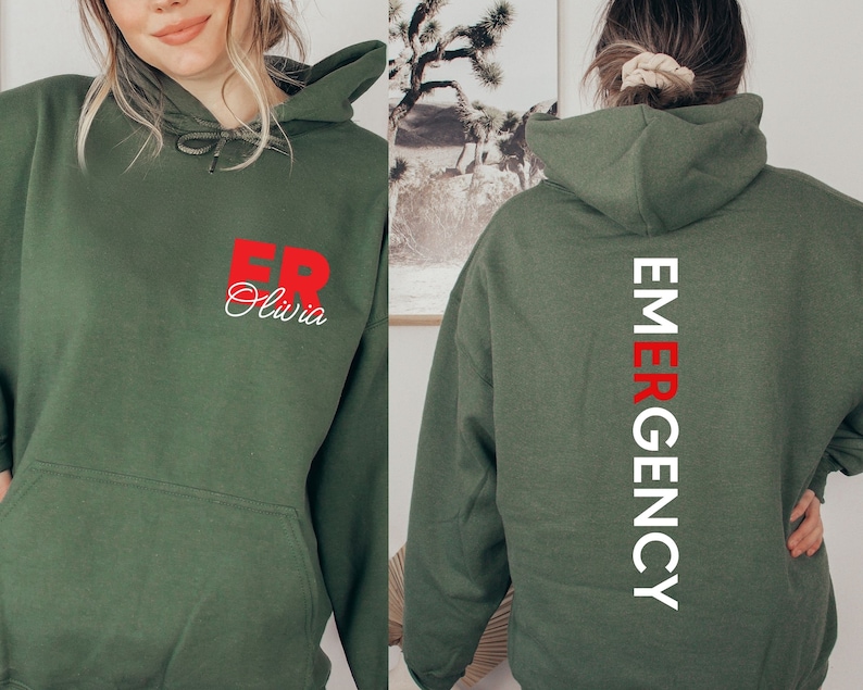 May include: A green hooded sweatshirt with the text "ER Olivia" in red on the front and "EMERGENCY" in white on the back.